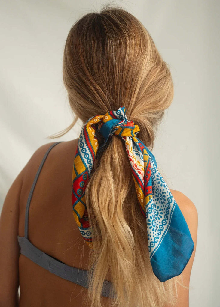 Woman wearing silk hair scarf in blue, yellow and red pattern — MYFASHIONFRUIT