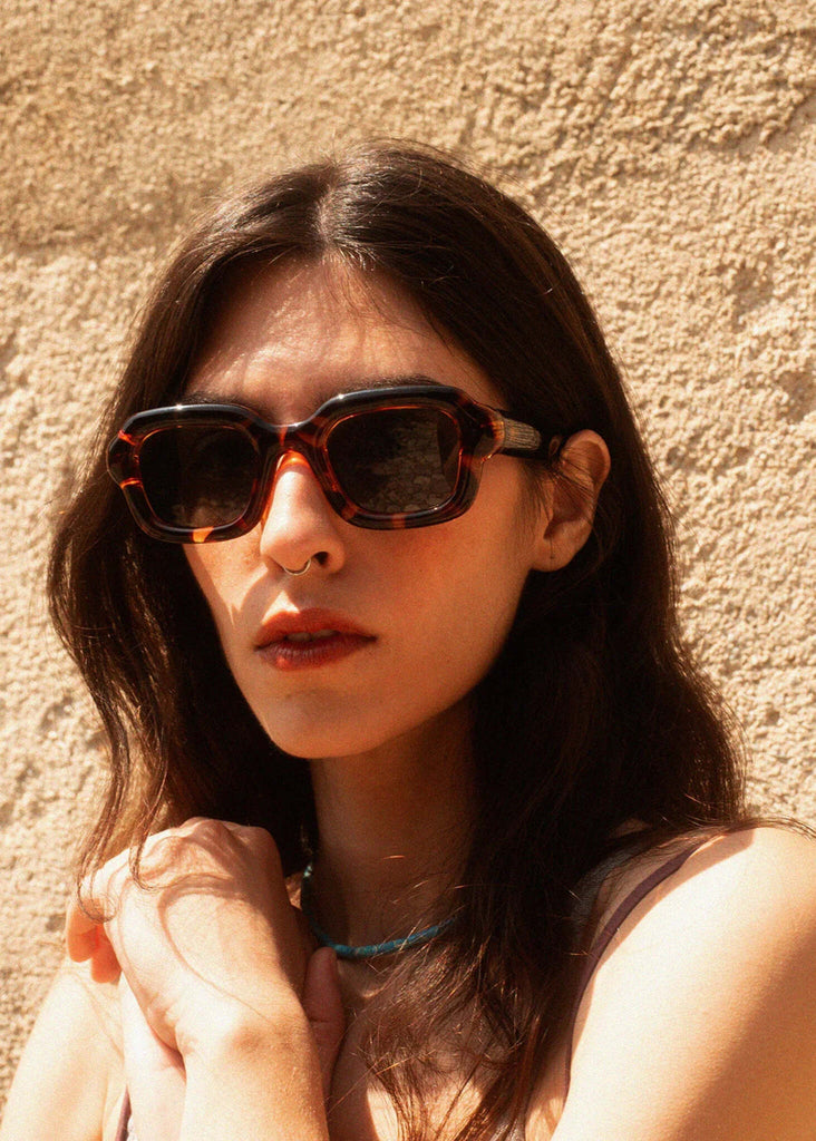 Woman wearing Komono MILES Havana Sunglasses — brown tortoiseshell frame — MYFASHIONFRUIT