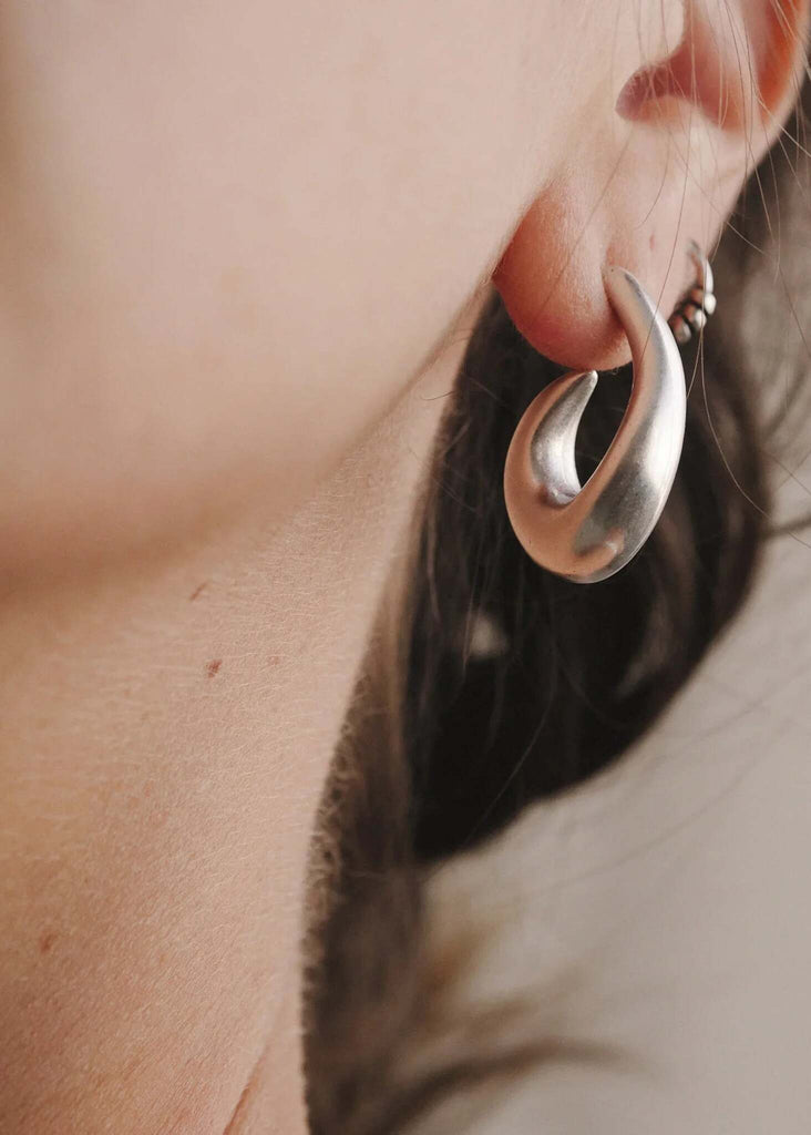 Bold Hook Earrings — Silver earring on model, detail — MYFASHIONFRUIT