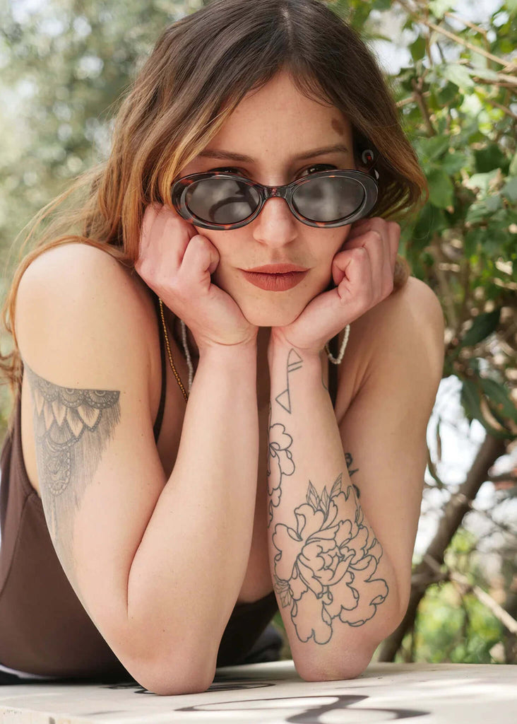 Woman wearing Komono ANA Tortoise Sunglasses with oval frame — MYFASHIONFRUIT