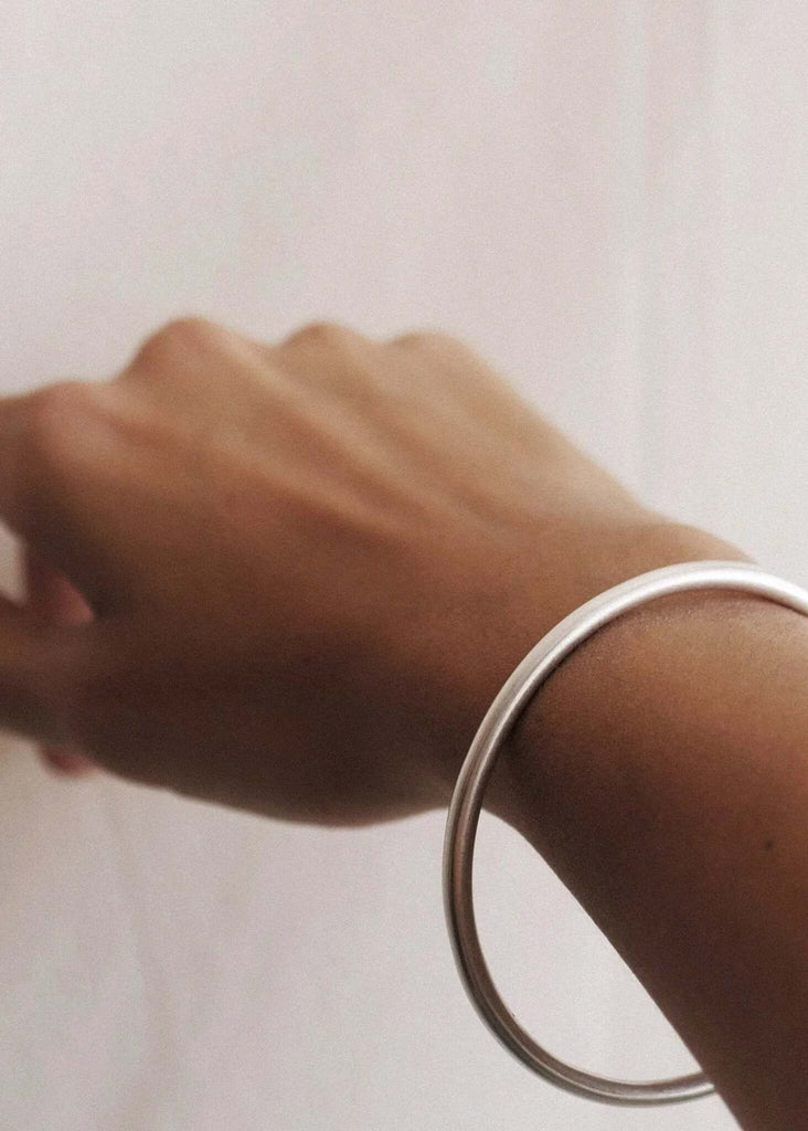 Kay Bracelet — Silver cuff on tan skin — MYFASHIONFRUIT