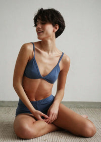 Woman wearing a Fierce Bralette set in faded denim blue — MYFASHIONFRUIT