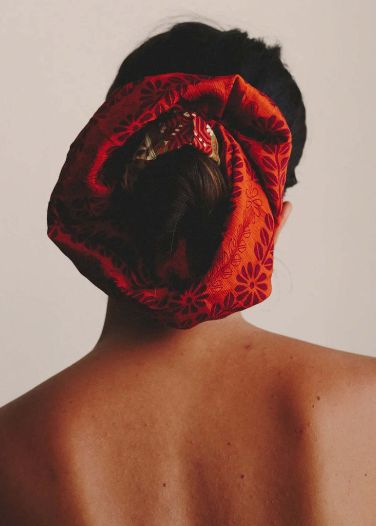 Woman wearing red floral Voluminous Silk Scrunchie in her hair, back view — MYFASHIONFRUIT