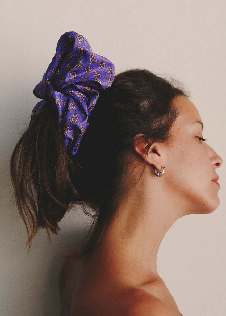 Woman wearing a purple floral Voluminous Silk Scrunchie in her hair — MYFASHIONFRUIT