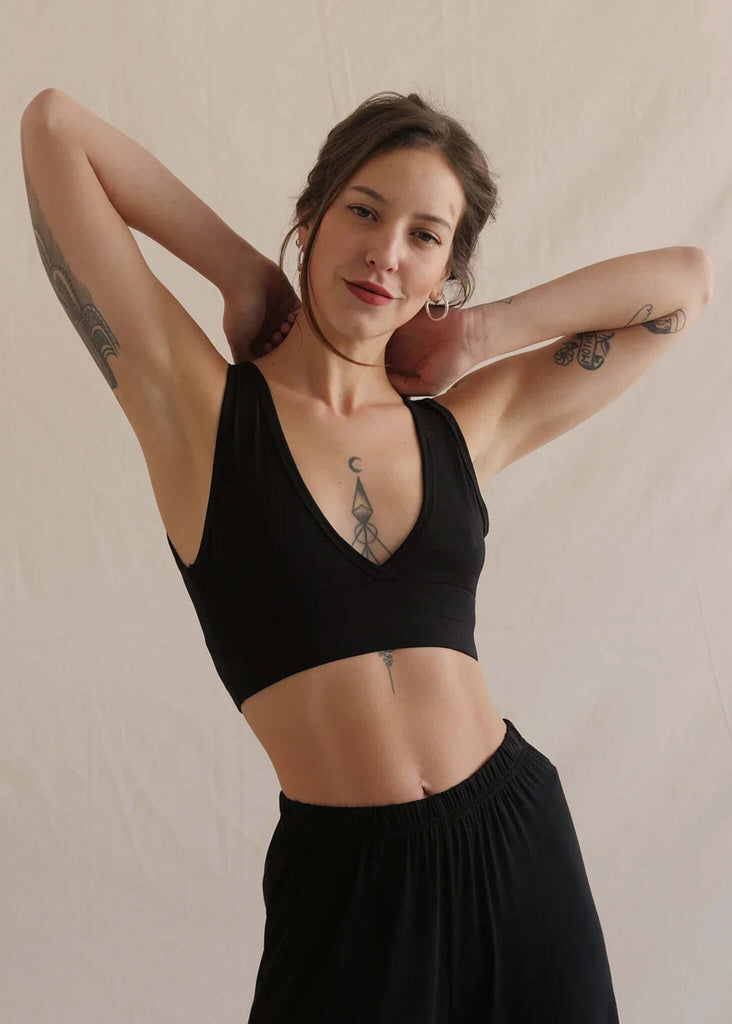 Woman wearing a soft black bralette with V neck and matching trousers — MYFASHIONFRUIT