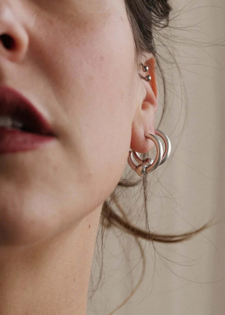 Peg Hoops — Silver earring on ear — MYFASHIONFRUIT