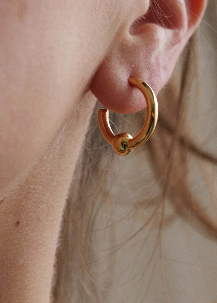 Peg Hoops — Gold knot detail on ear — MYFASHIONFRUIT