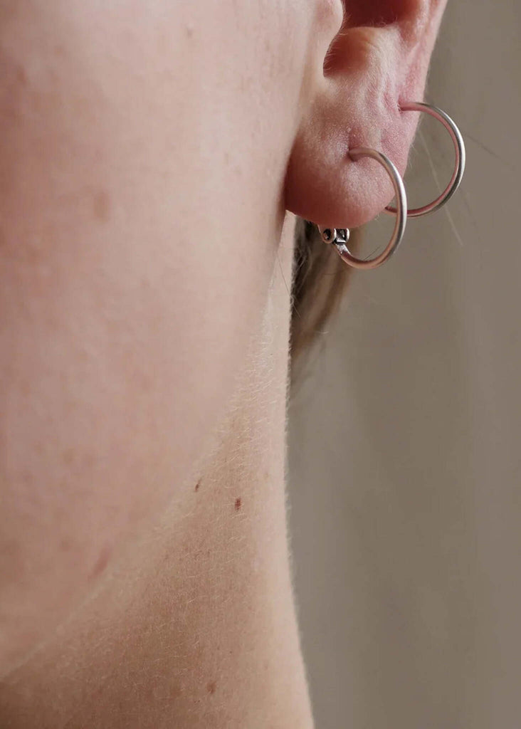 Lola Hoops — silver tone small hoops on model — MYFASHIONFRUIT