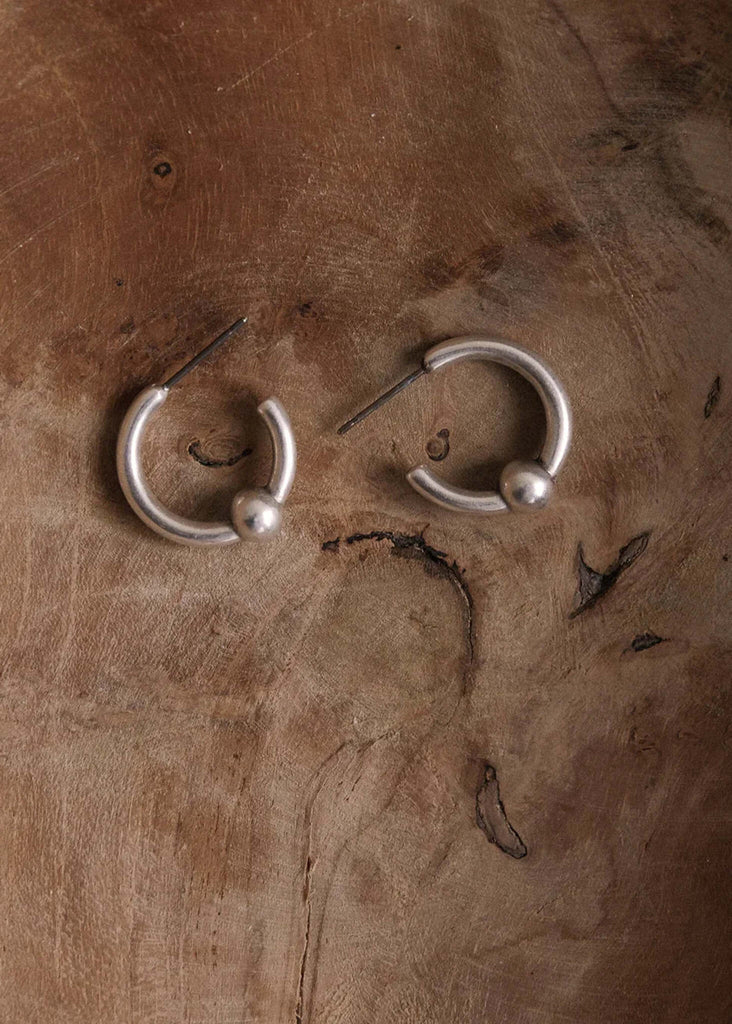 Peg Hoops — Silver hoops on wood — MYFASHIONFRUIT