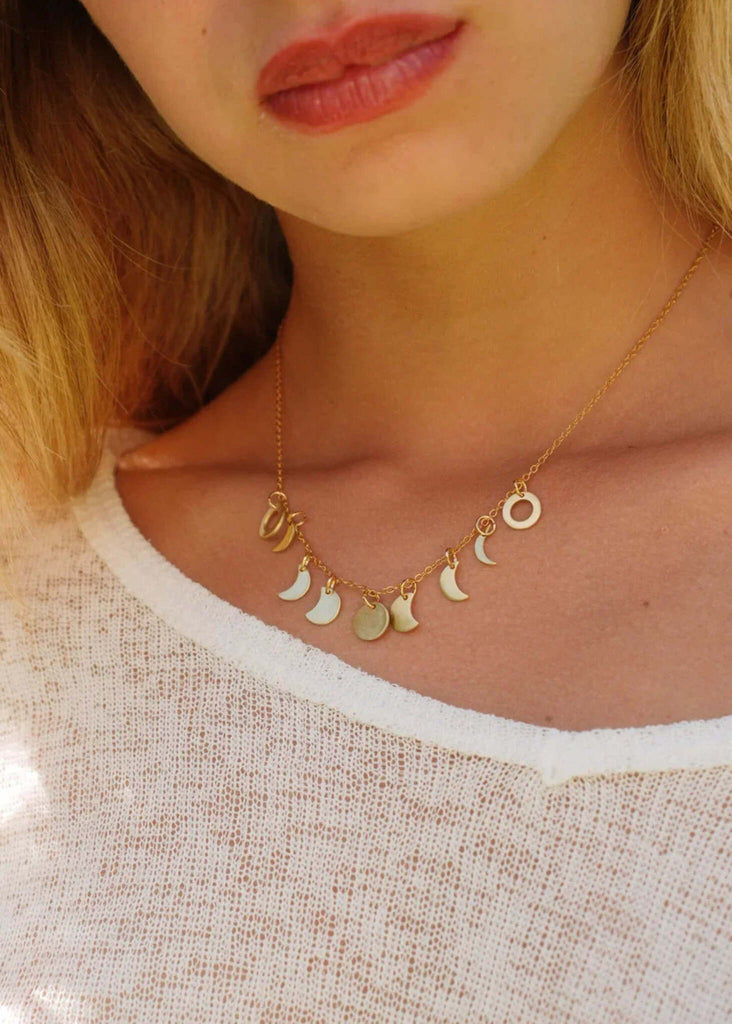 Woman wearing Luna Necklace — gold chain with moon phase pendants — MYFASHIONFRUIT