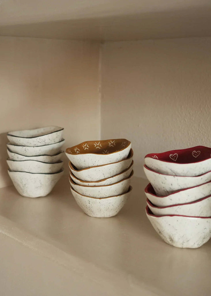 Gaia Tribal Bowl — White ceramic bowls with black, red heart, and gold pattern detail — MYFASHIONFRUIT