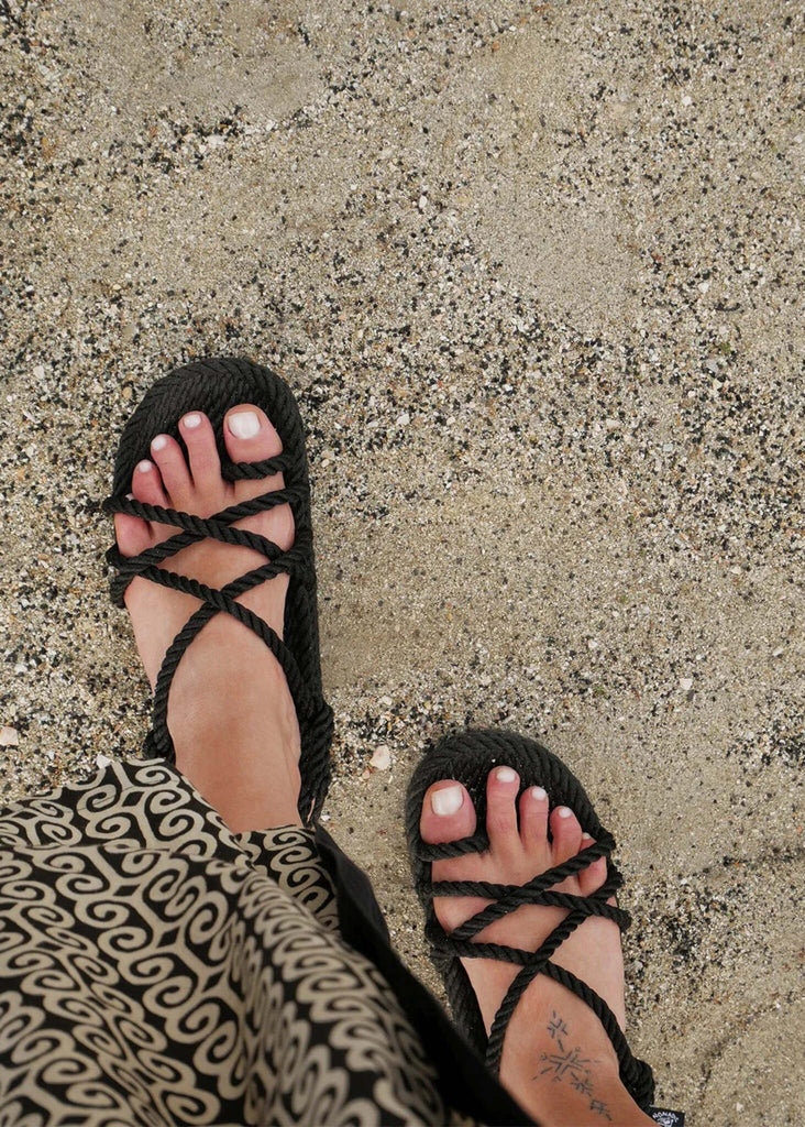 Toe Joe Black Sandals — detail of rope straps on feet on sand — MYFASHIONFRUIT