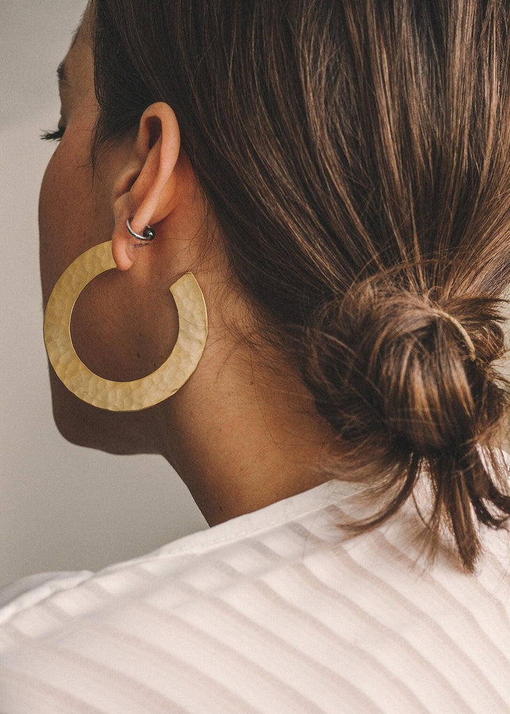Candra Golden Hoops detail — gold hammered metal, on model — MYFASHIONFRUIT