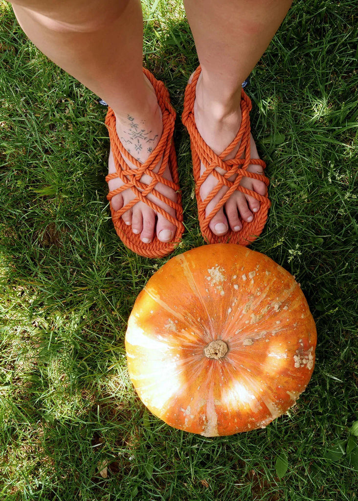 Woman wearing JC Pumpkin Sandals with rope straps, pumpkin on grass — MYFASHIONFRUIT