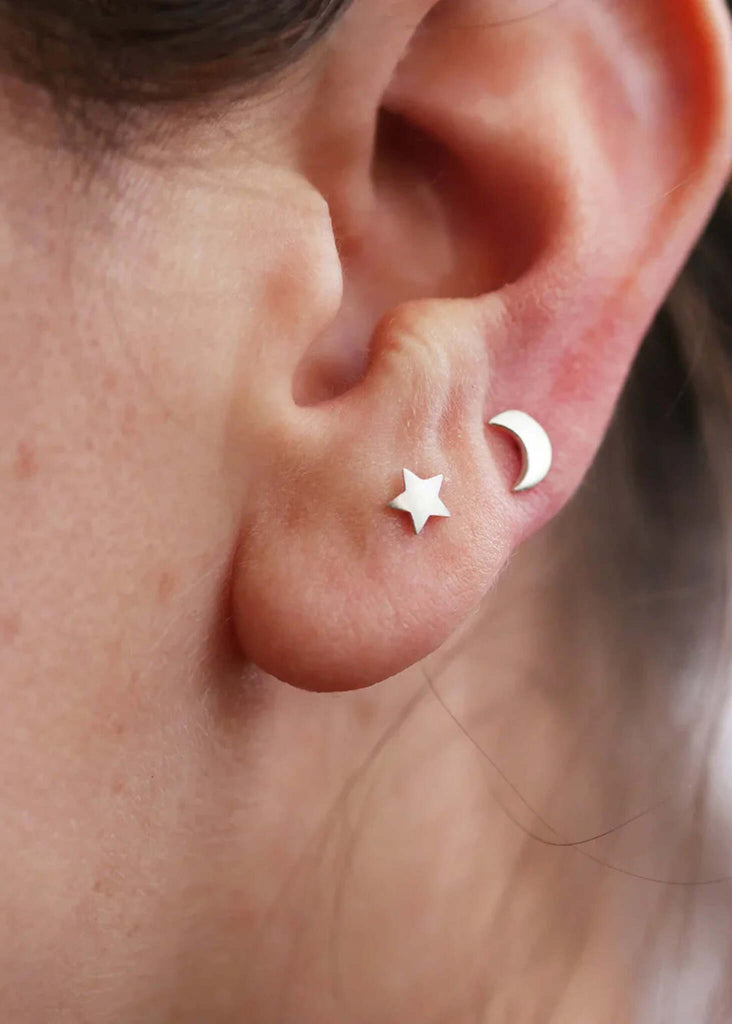 Moon & Star Earrings detail — two silver studs, a star and a moon — MYFASHIONFRUIT