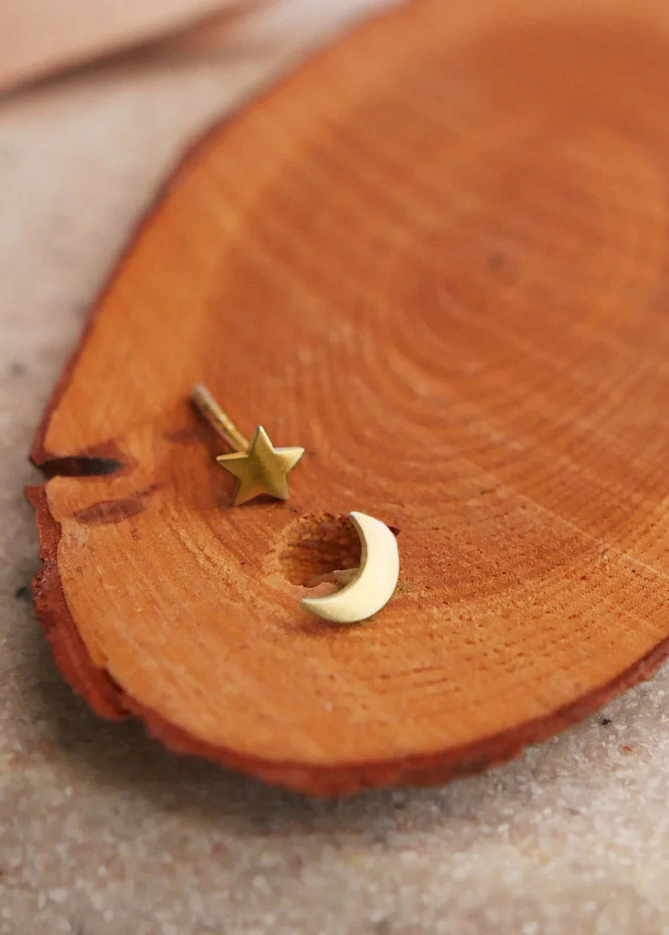 Moon & Star Earrings — gold star and moon studs on wood — MYFASHIONFRUIT