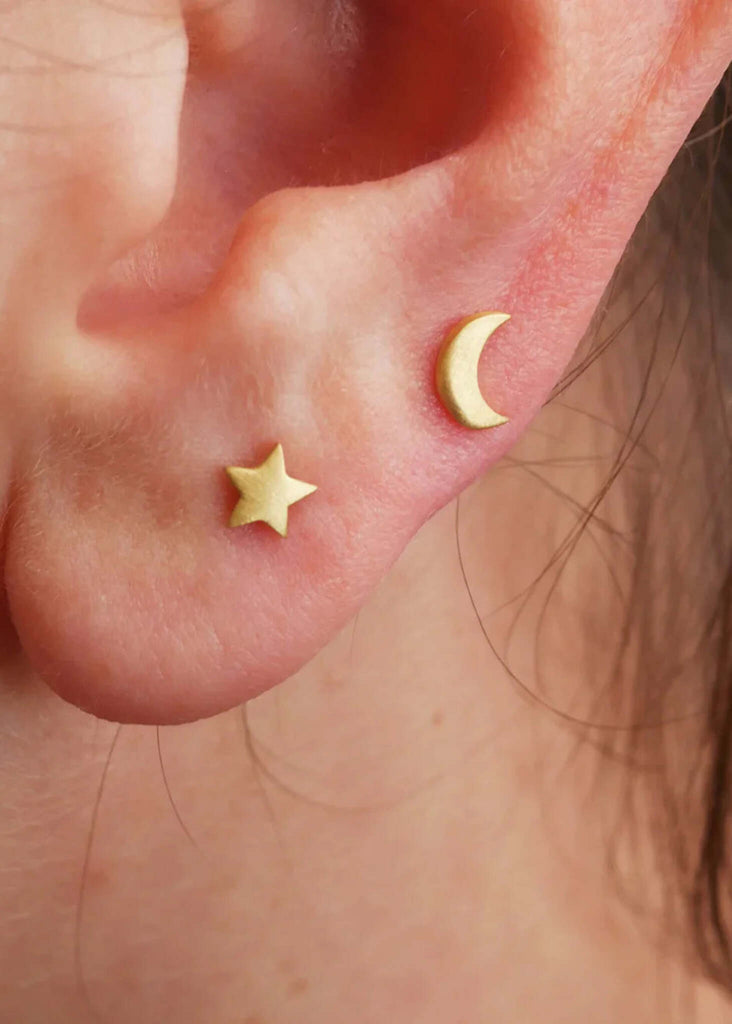 Moon & Star Earrings — gold moon and star studs in pierced ear — MYFASHIONFRUIT