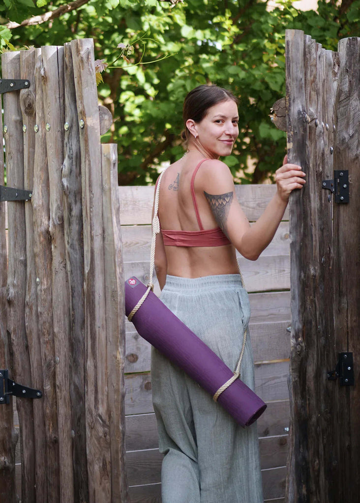 Woman wearing the purple Rope Yoga Mat Holder over shoulder — MYFASHIONFRUIT