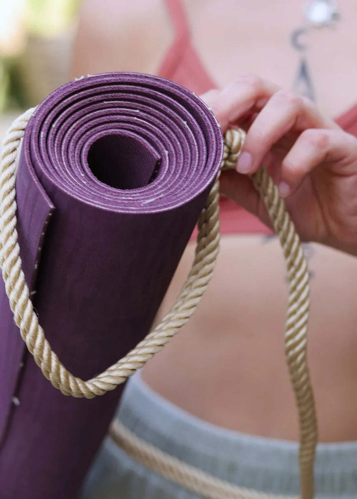 Rope Yoga Mat Holder — purple mat rolled up with beige rope carrier — MYFASHIONFRUIT